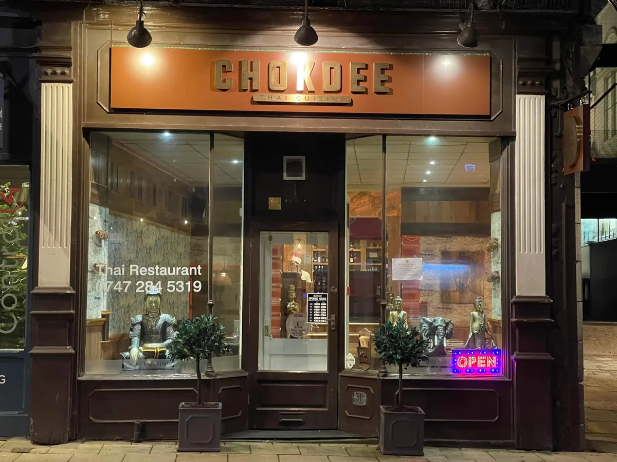 Chokdee Thai Cuisine shopfront at 31 Church Street, Ilkley, lit up in the evening