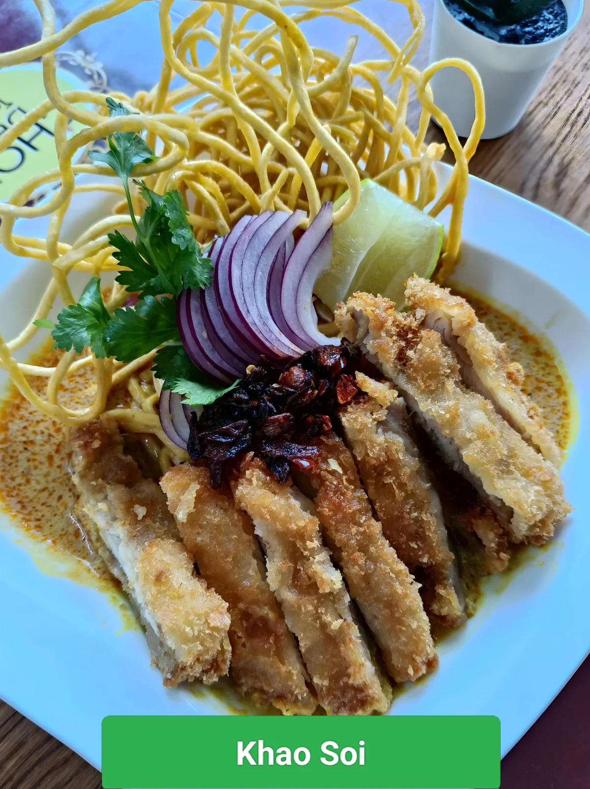 Khao Soi at Chokdee Thai Cuisine, with its name printed on the photograph